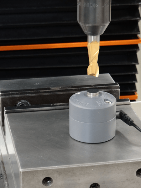 A TT-1 tool touch off probe is shown under a tool